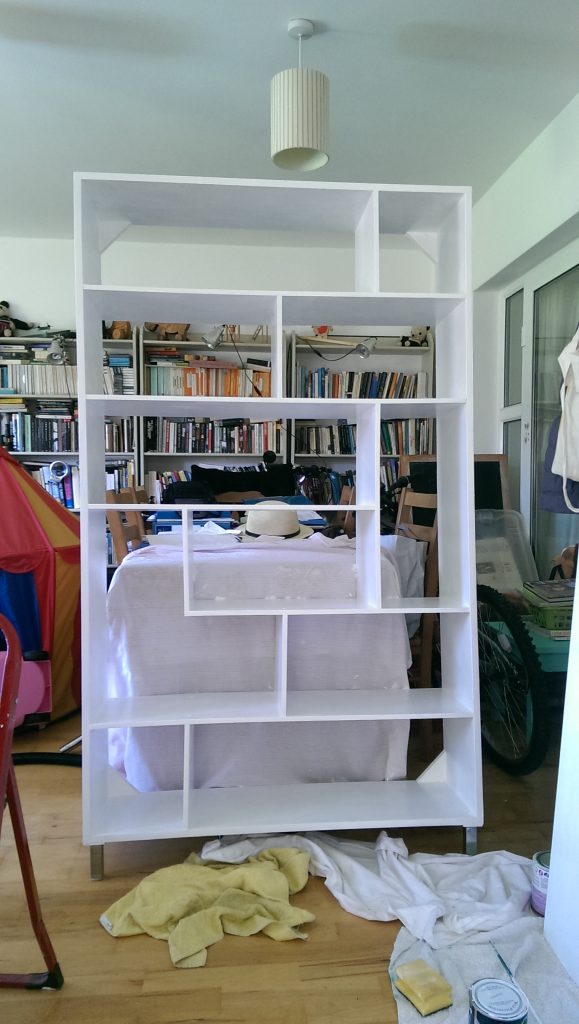 Shelving unit being painted