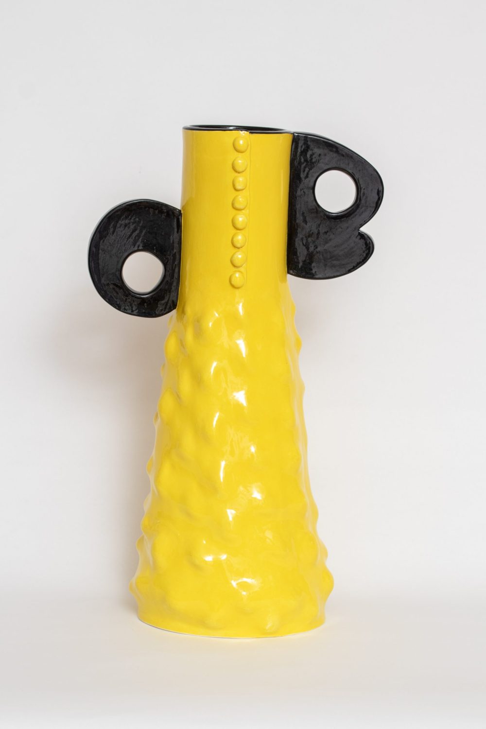Yellow and black sculptural ceramic vessel