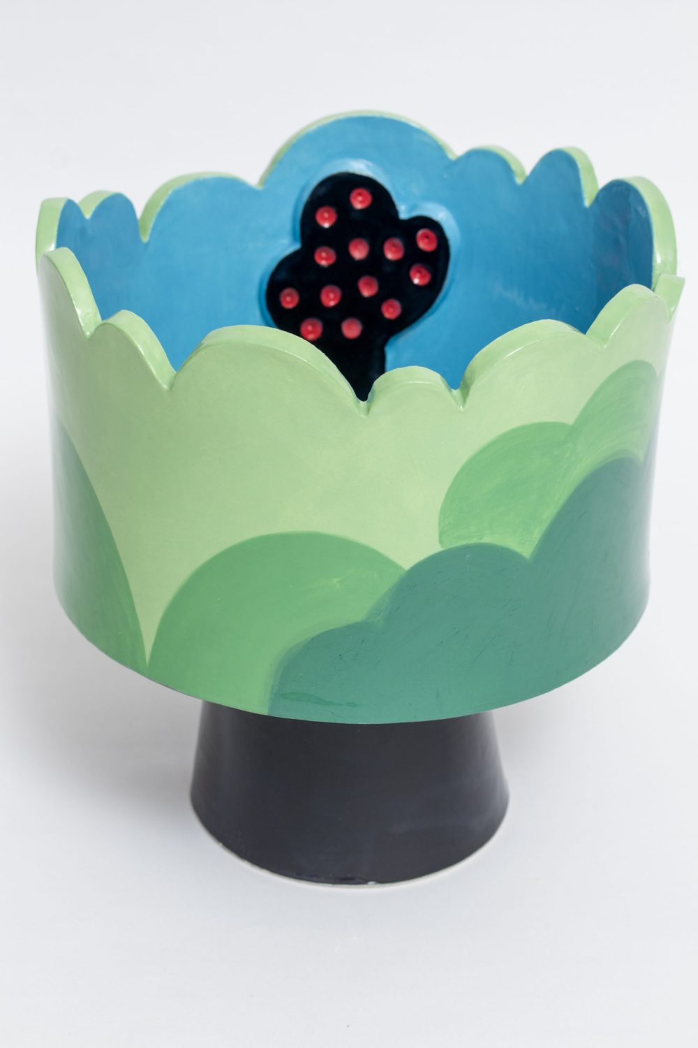 Blue and green sculptural ceramic vessel with tree an lake